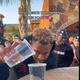 Juju Smith-Schuster pours water into a plastic cup.